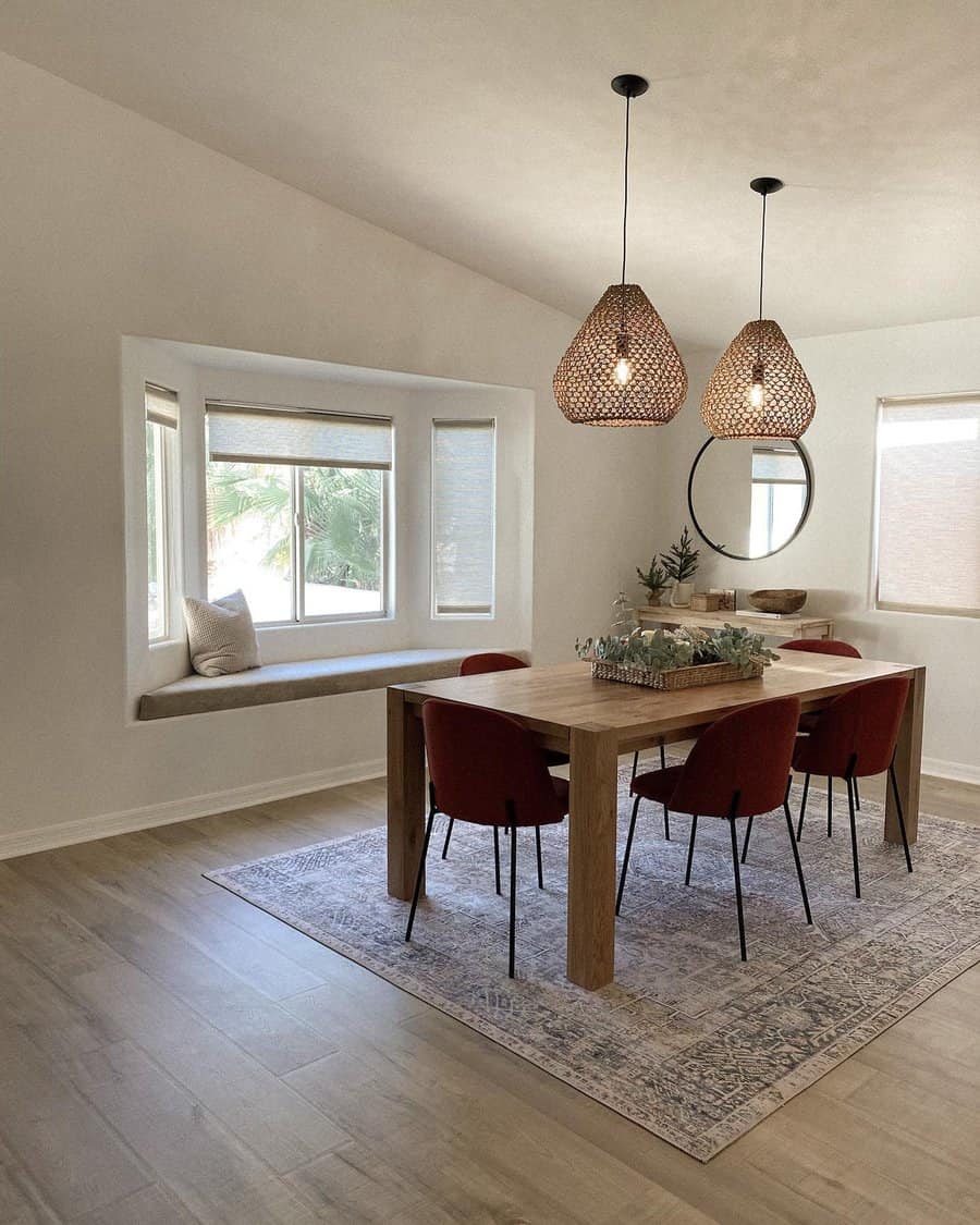 Modern dining room with pendant lights and red chairs