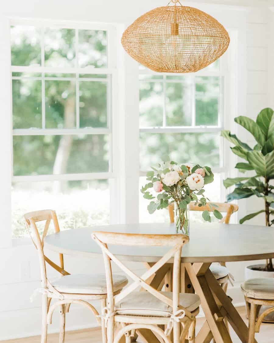 Bright dining area with wicker lighting and chairs