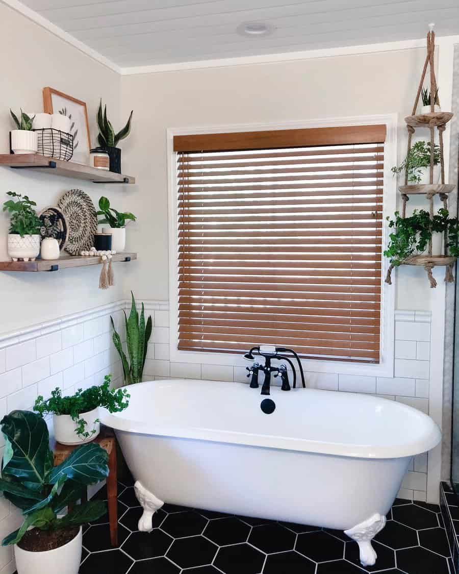 White clawfoot tub in a boho style bathroom
