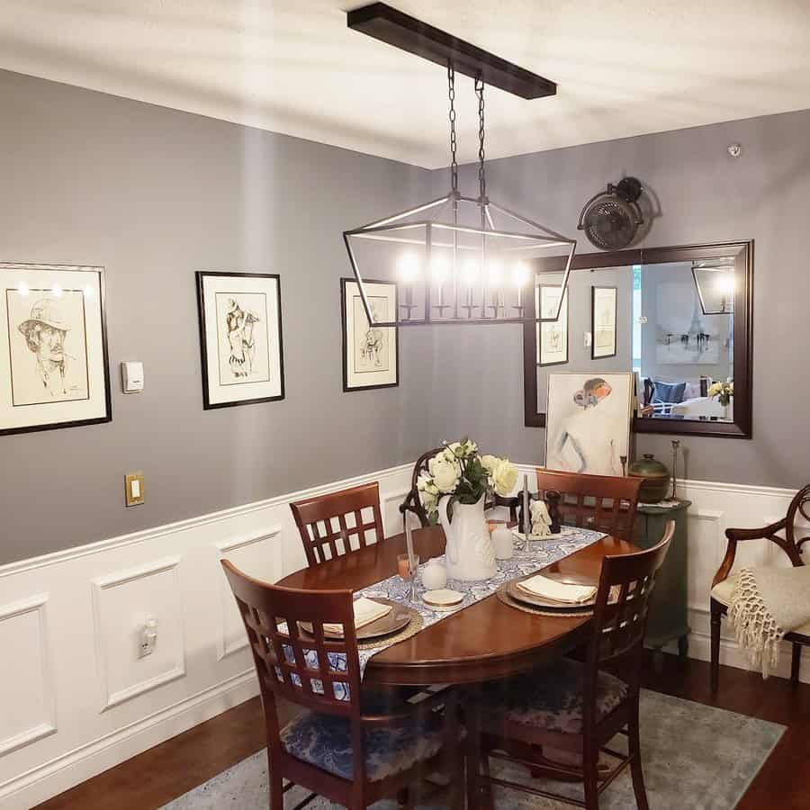 Traditional dining with geometric chandelier and artwork