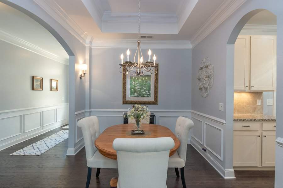 Classic dining room with chandelier and arched doorways