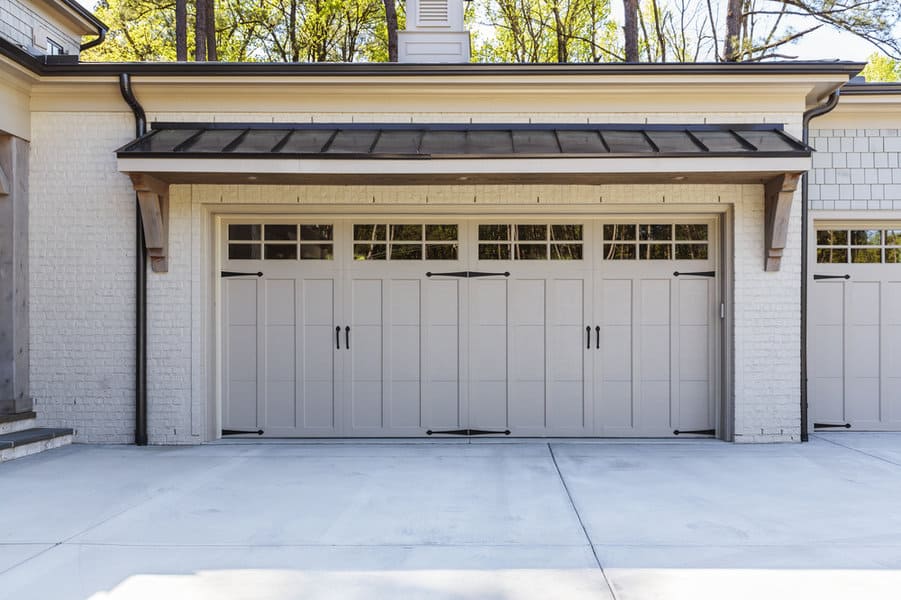 Contemporary Garage Door Ideas 2 Triple beige garage doors on white brick home