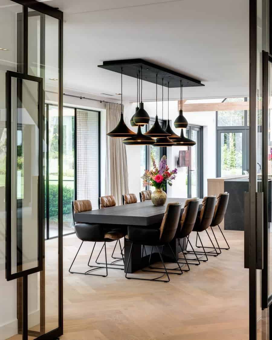 Sleek dining room with contemporary black pendant lights