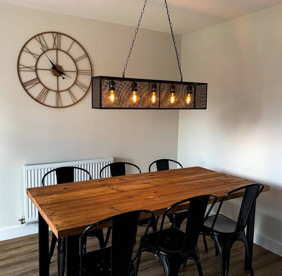Cozy dining area with industrial pendant light