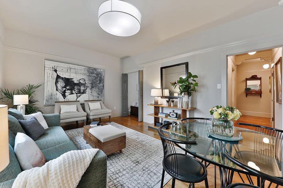 Spacious living room with large art piece