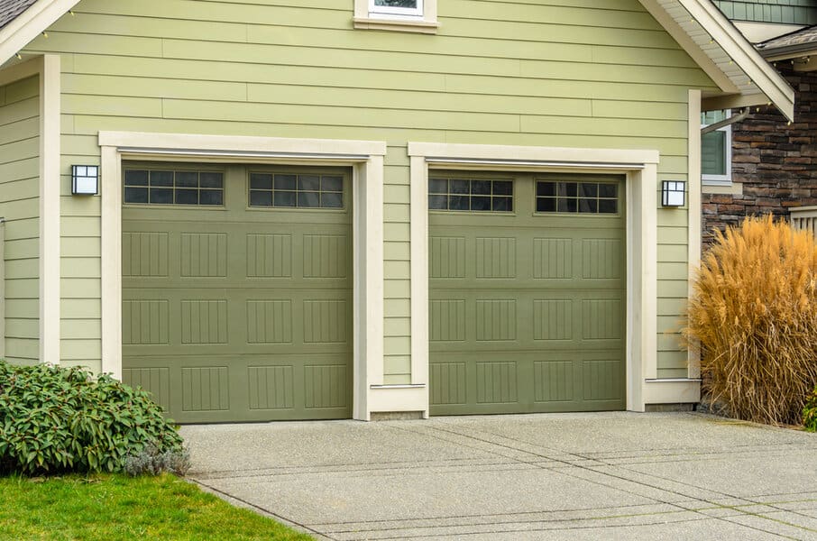 Painted Garage Door Ideas Dual green garage doors on a beige house with landscaping