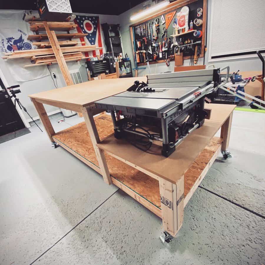 Table saw on large wooden workbench in a tidy garage