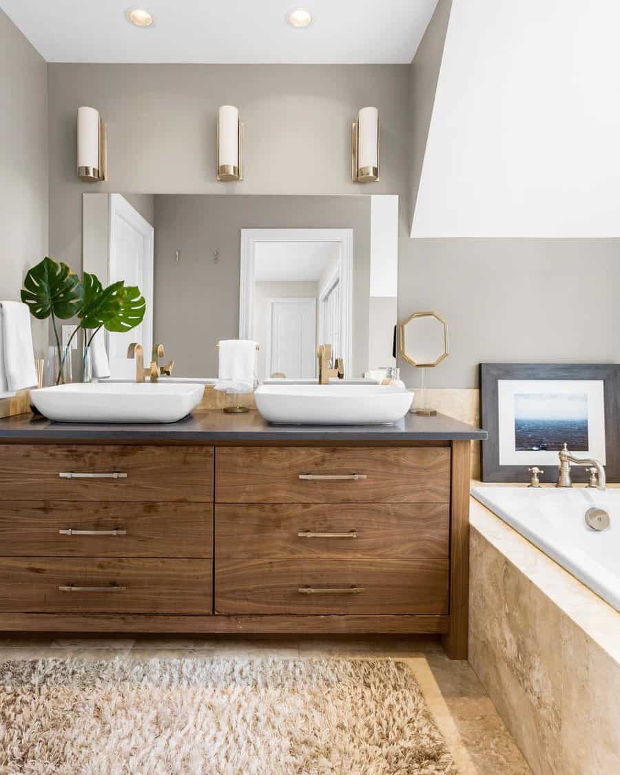 Chic bathroom with wooden vanity and dual vessel sinks
