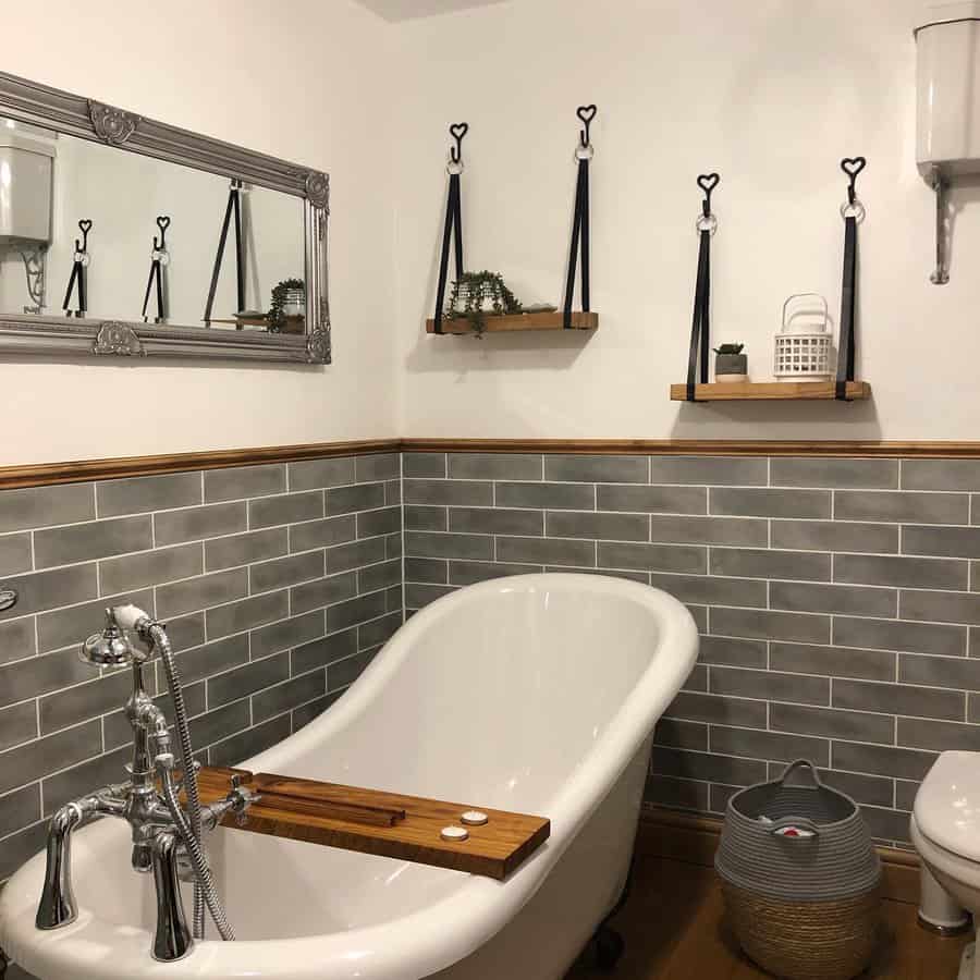 Charming bathroom with clawfoot tub and grey tiles
