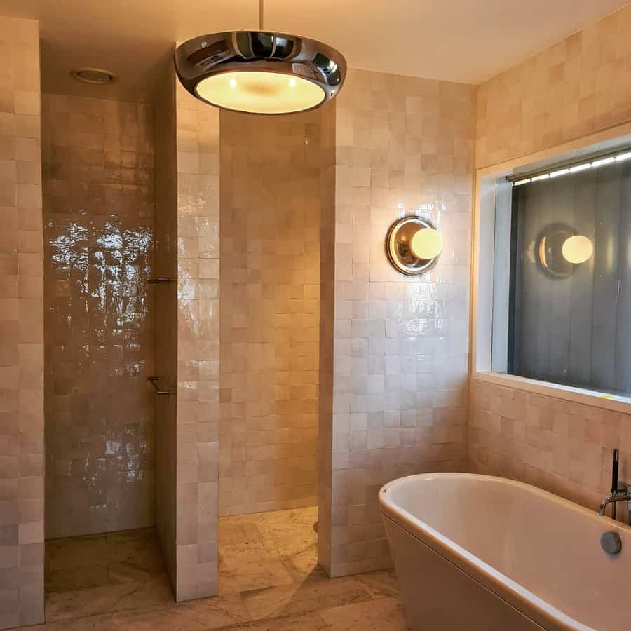 Vanity bathroom with wall-mounted lighting