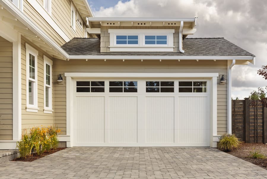 White Garage Door Ideas 2 Craftsman style home with white garage door and paved driveway