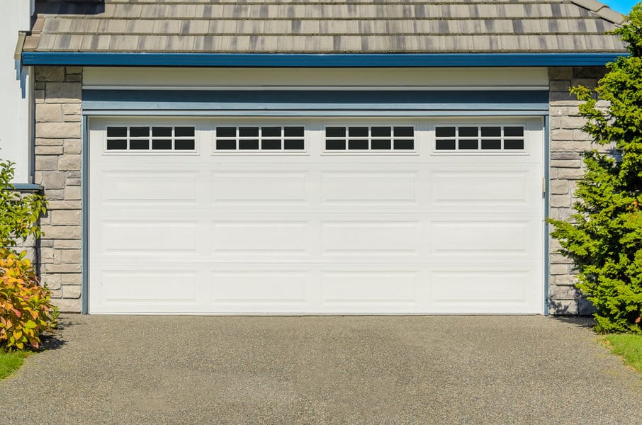 White Garage Door Ideas 4 Rustic house with white wooden garage door and stone accents