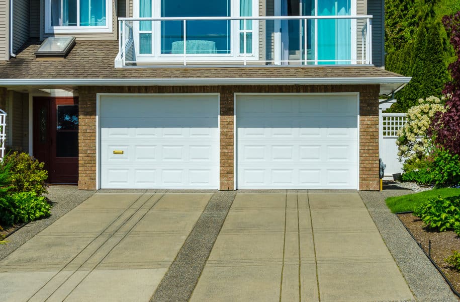 White Garage Door Ideas 5 Rustic house with white wooden garage door and stone accents