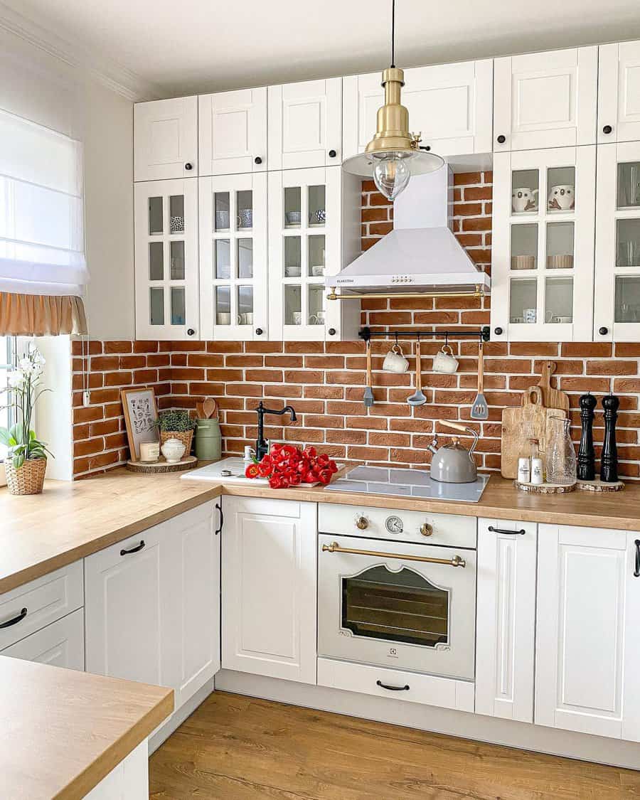 Country Tiny Kitchen Ideas-_magnoliahome Farmhouse kitchen with brick backsplash and white cabinets
