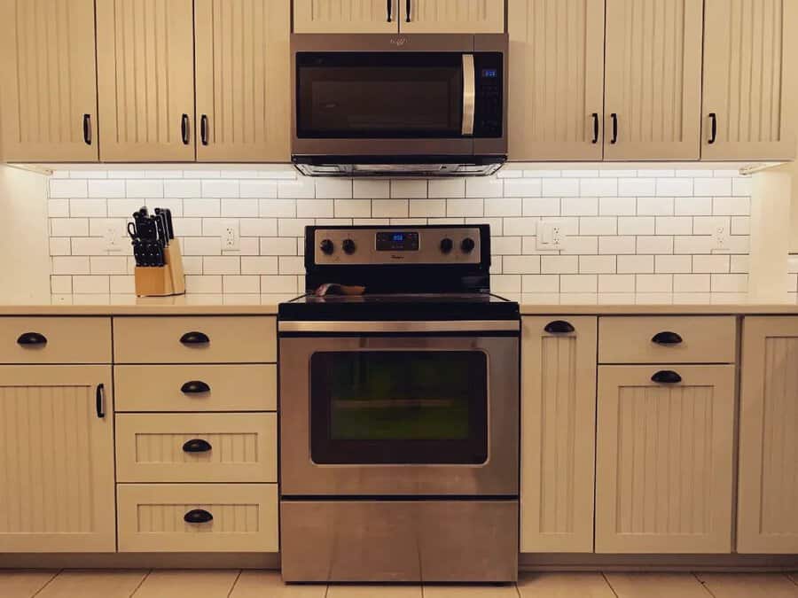 White beadboard kitchen cabinets