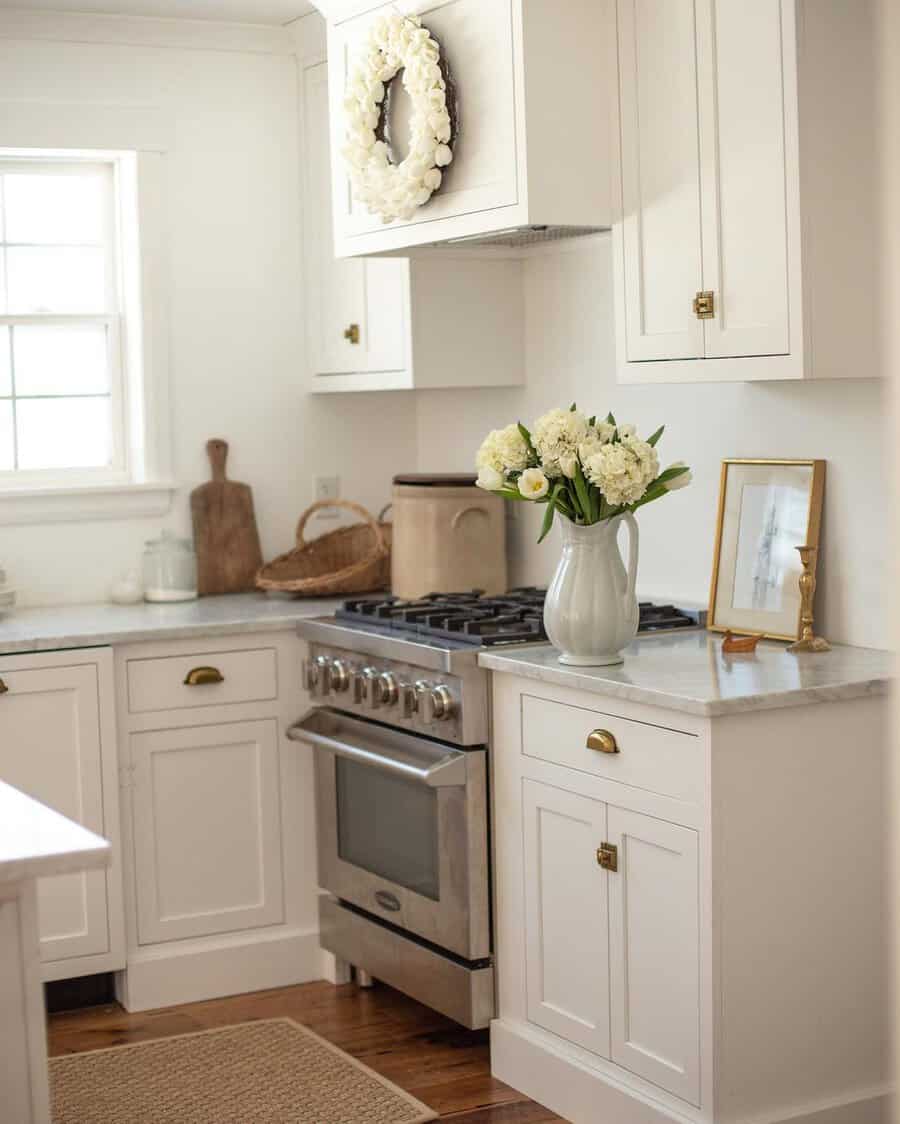 White cabinets with marble countertop