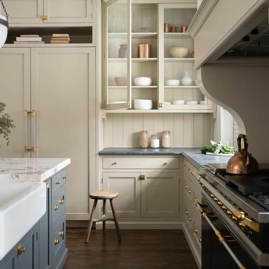 White kitchen cabinets with gold metalware