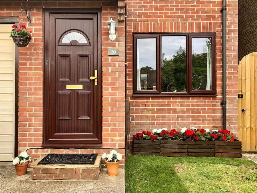 Raised flower bed against house