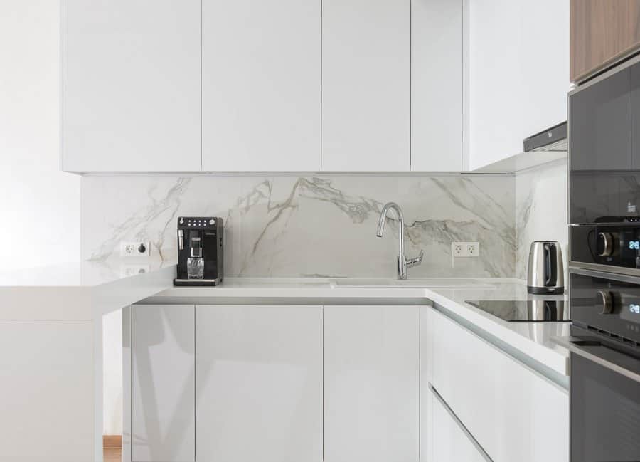 Minimalist white kitchen cabinets