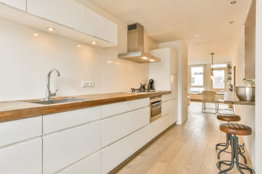 White cabinets with wood countertop