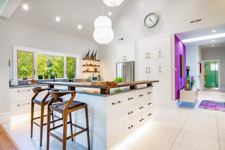 White kitchen cabinets with gold metalware