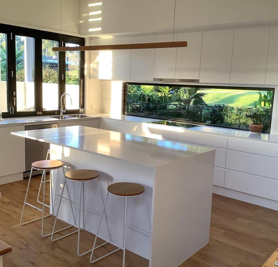 White cabinets with letterbox window backsplash