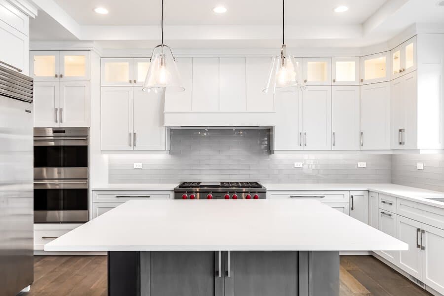 White kitchen cabinets with subway tile backsplash