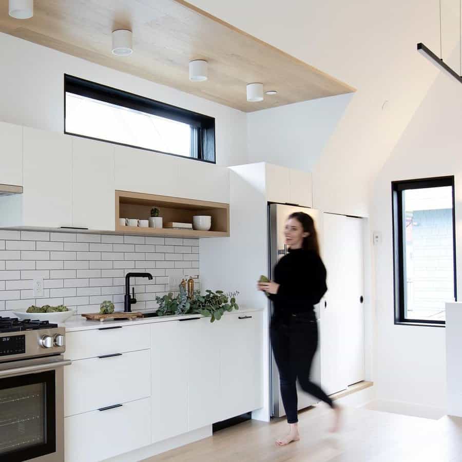 White kitchen cabinets with subway tile backsplash