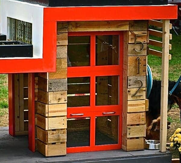 Modern dog house with a sign number