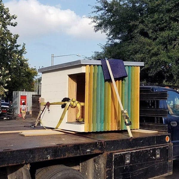 Dog house with vibrant vertical slats