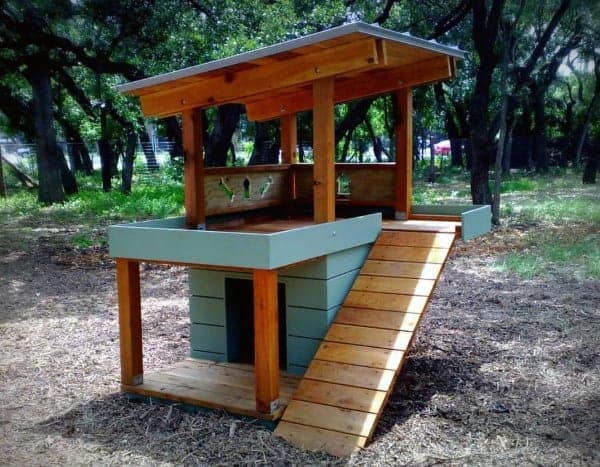 Two level dog house with a deck