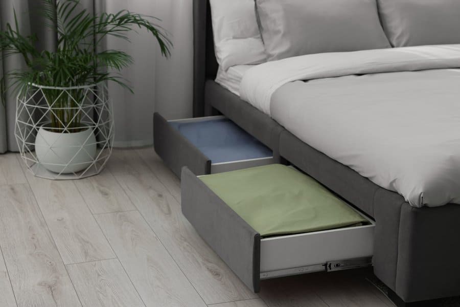 Storage drawers with bedding under modern bed