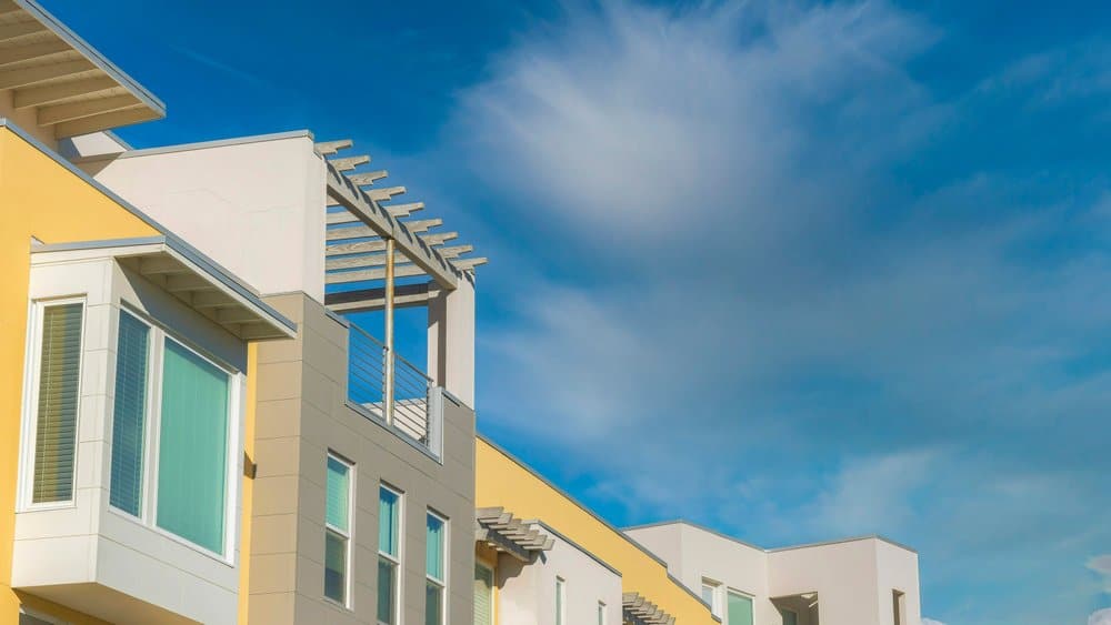 Apartment patio with attached pergola